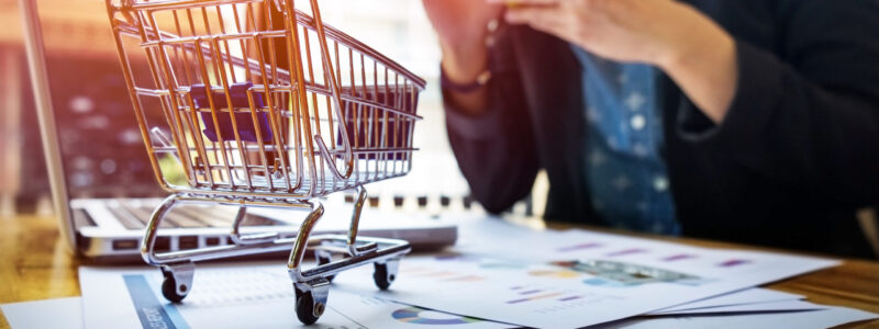 Cropped image of woman inputting card information and key on pho Cropped image of woman inputting card information and key on phone or laptop while shopping online.